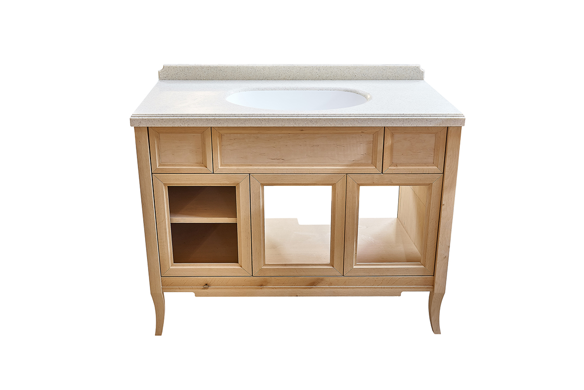 A bathroom vanity with no doors or sink