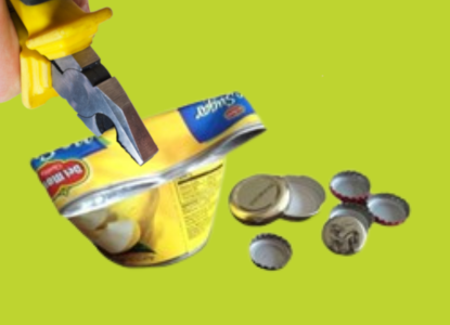 A hand using pliers to crimp shut a tin can with examples of metal bottlecaps resting next to it