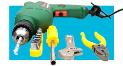 Drill and hand tools on a color background