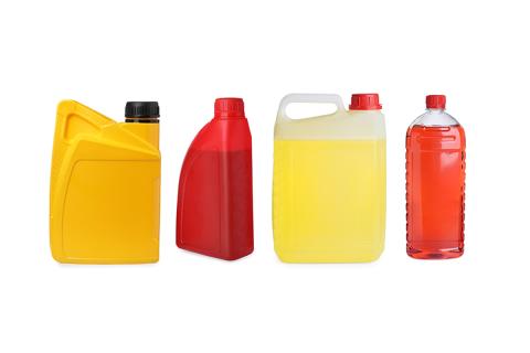 Several bottles of automotive fluids, like oil, transmission fluid and washer fluid