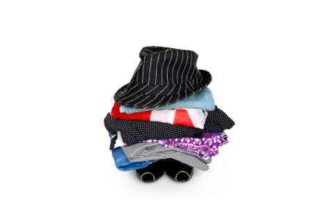 Pile of clothes with a hat on top