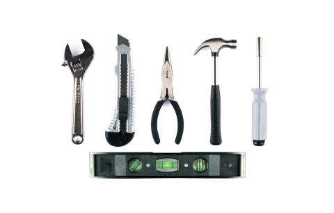 A selection of hand tools, including a hammer, pliers and screwdriver