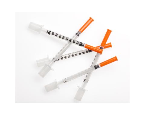 Medical needles with caps
