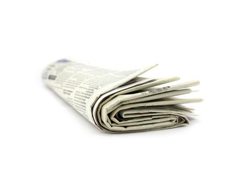 A rolled newspaper