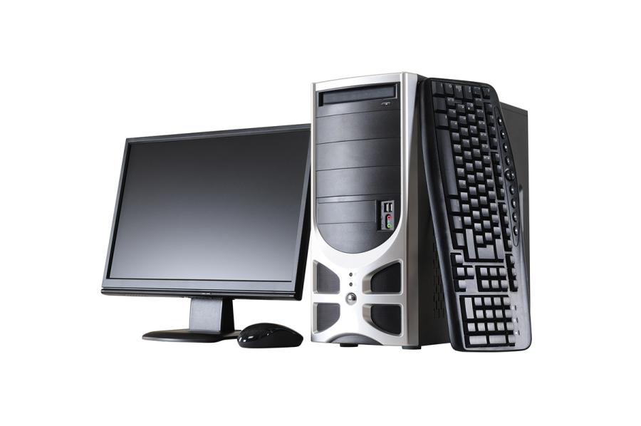 A computer monitor, desktop computer tower and keyboard
